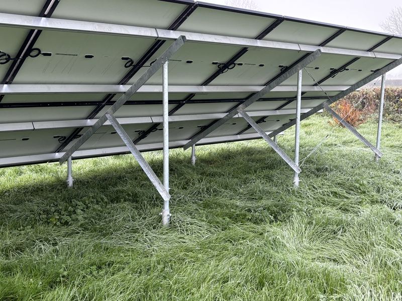 Galvanised steel racking frame under a ground mounted solar array in Ireland